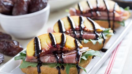 peach proscuitto crostini with medjool date balsamic glaze