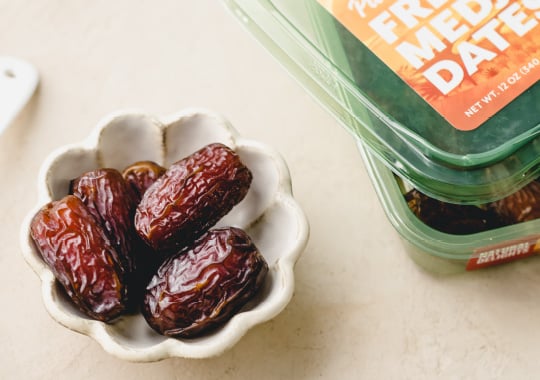 a small bowl of Natural Delights dates